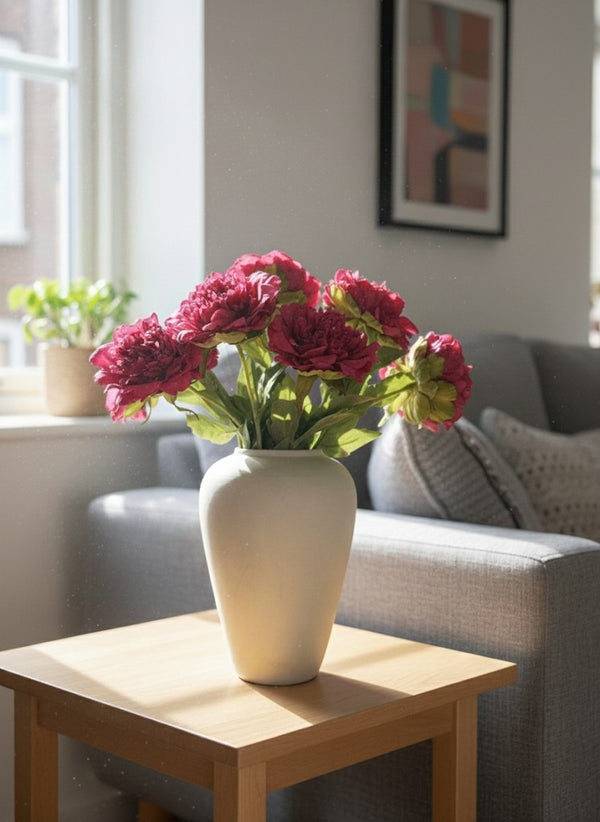 Luxury pink artificial peonies styled in ceramic vase in modern living room #fuchsia-pink